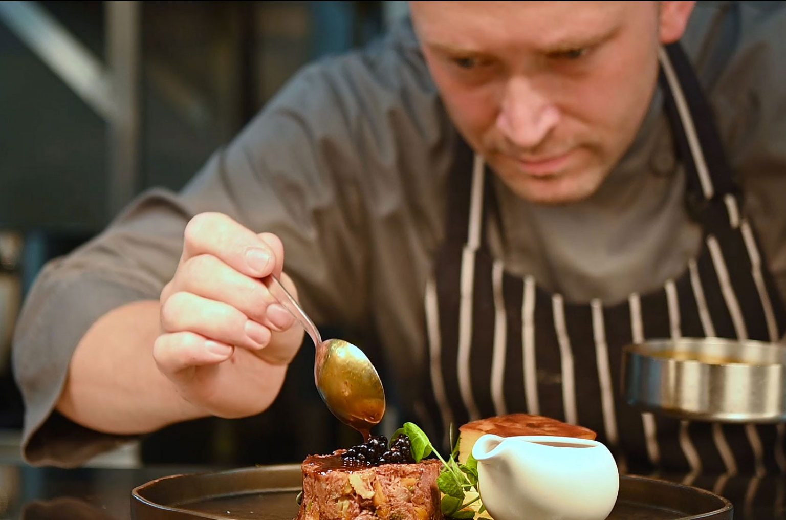 Chef adding the final touches to a meal at St Mary's Hall Hotel